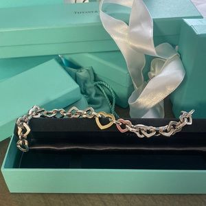 Tiffany & Co sterling silver and 18 kt gold heart link bracelet